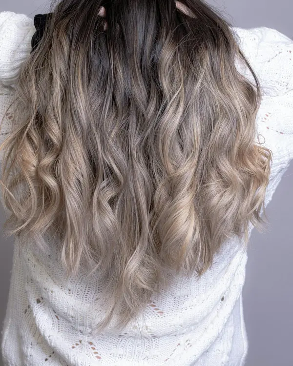Soft blow-dried waves on long dark hair