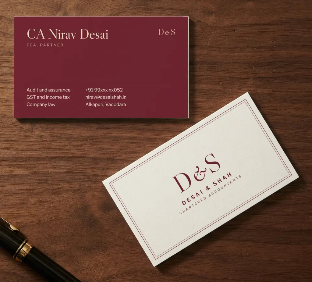 Ivory chartered accountant cards with a burgundy D&S monogram in a double frame, and a burgundy back listing services and contact details